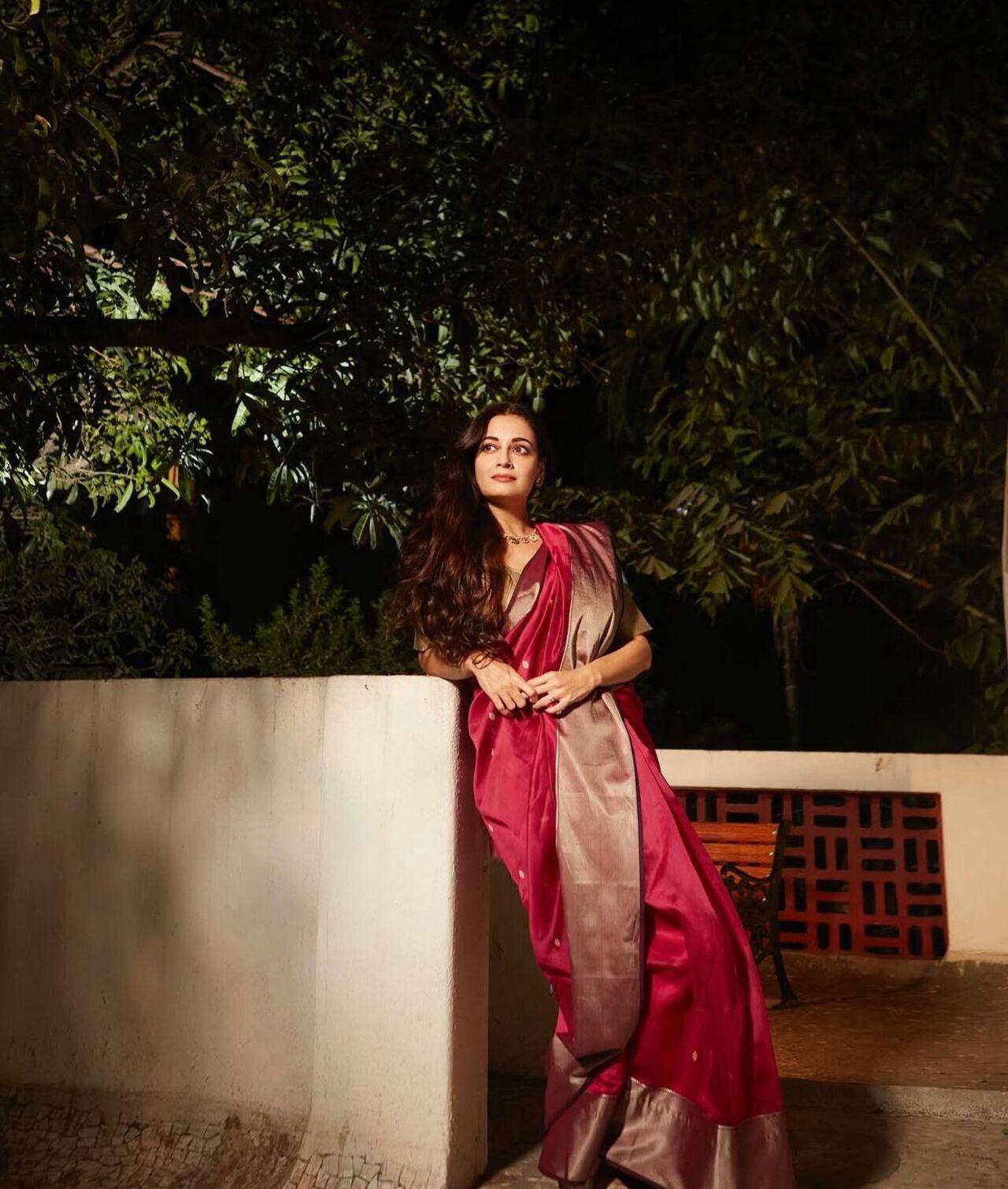 Dia channels serenity and feminine strength in her red ensembles, balancing devotion with elegance.
